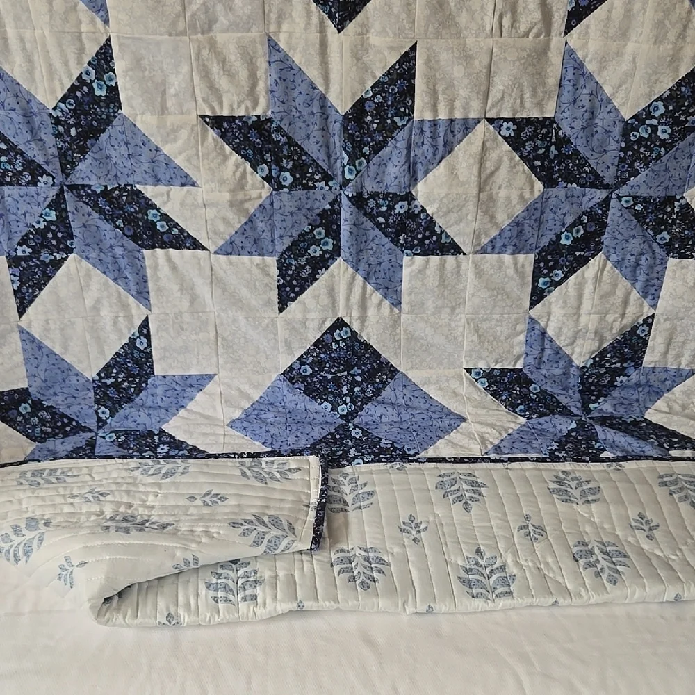 Blue and White Star Pattern Quilt